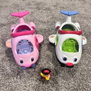2 fisher price airplanes and 1 character